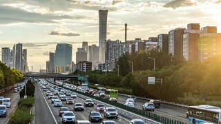 Traffic in Beijing, China, where sales of electric vehicles are skyrocketing to the point of altering the global flow of crude oil.