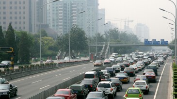 Beijing City Street Traffic Jam With Cars and Grey Sky