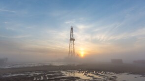 Fracking oil rig in the morning fog
