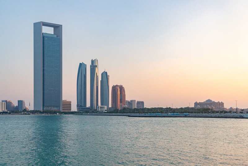 On the left, the Abu Dhabi National Oil Company (ADNOC) headquarters towers over the Abu Dhabi coast. Between 60 and 190 km offshore, the Ghasha concession is the site of a recent breakthrough, where hydraulic fracturing has unlocked a reservoir rock that stymied engineers for decades. Source: Bruno Coelhopt/Getty Images.