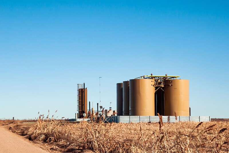 A tank battery in an oil field where oil and produced water are stored.