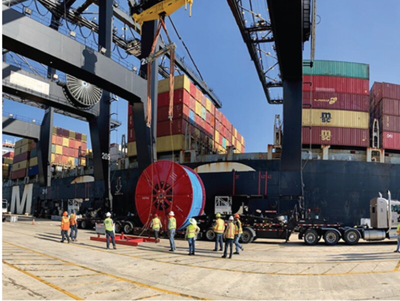 A large-OD CT spool carrying 40,000 ft of string length is offloaded at the work location on a conventional trailer.