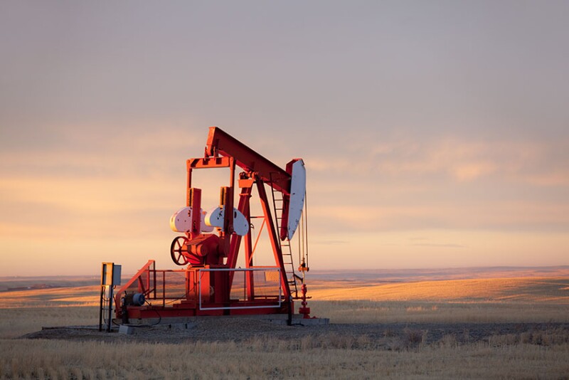A pumpjack on the prairie. Alberta, Canada. This oil rig is located near Turner Valley, Alberta