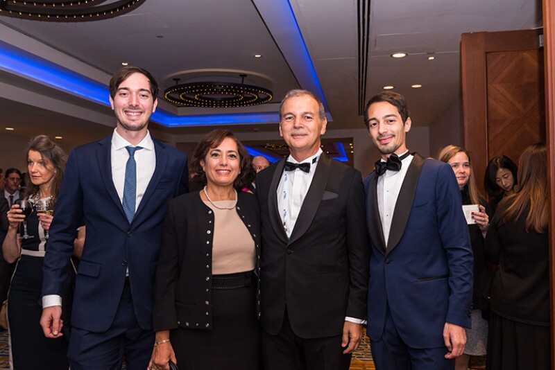 Kamel is pictured with (left to right) his son Khalil, wife Najoua, and son Anis.