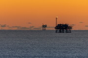 Offshore Drilling Platforms during Sunset in the Gulf of Mexico