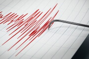 Seismograph recording the seismic activity of an earthquake