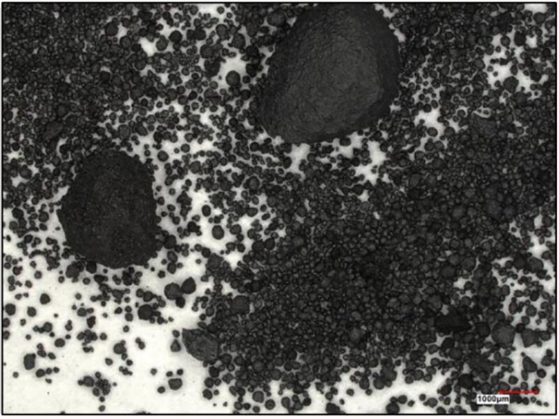 A photo taken using a microscope of unsieved petcoke proppant. Source: ExxonMobil/URTeC 4264319.