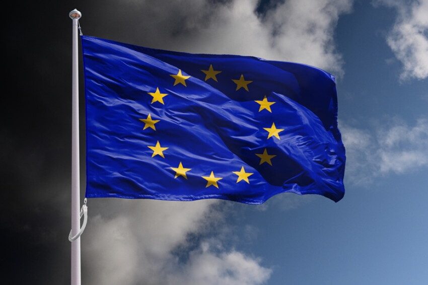 EU flag above dark sky