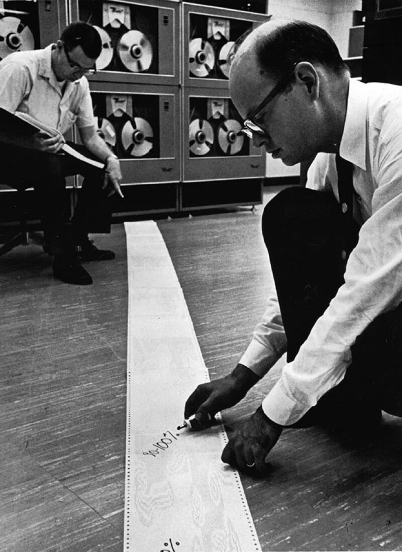 Donald J. Peaceman, left, uses one of Humble’s early computers in the 1960s.