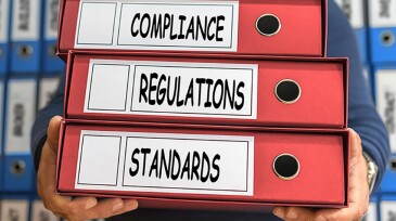 Regulations, Compliance, Standards, concept words. Folder concept. Ring binders.