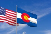 USA and Colorado flags over blue sky background. 3D illustration