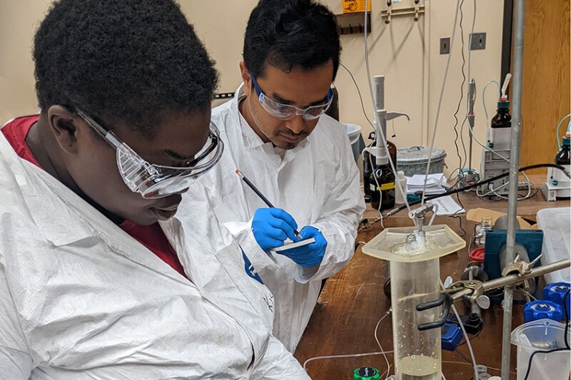 Tchemongo Berte (left) is studying low-salinity waterflooding assisted by a fellow University of Oklahoma grad student, Nayem Ahmed, whose research supports alternative energy.