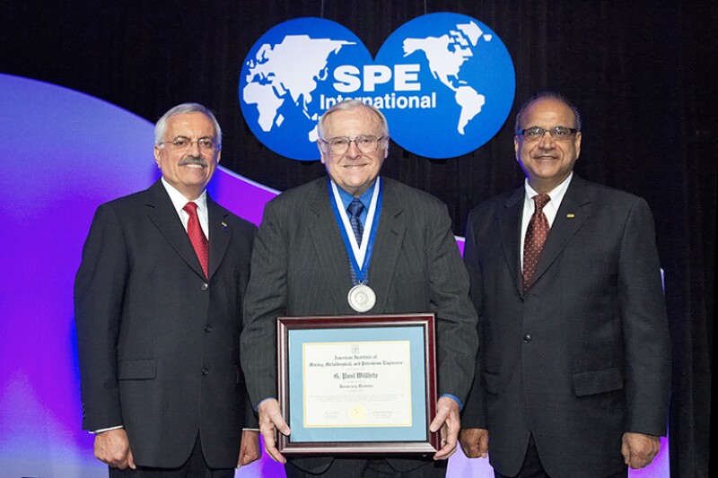 Paul with Behrooz Fattahi (left), and Ganesh Thakur (right), receiving the Honorary Member award at the 2012 ATCE awards ceremony.