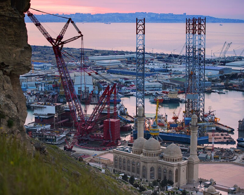 The Prime Exerter jackup drilling rig in the shadow of the minarets of the Bibi-Heybat Mosque.