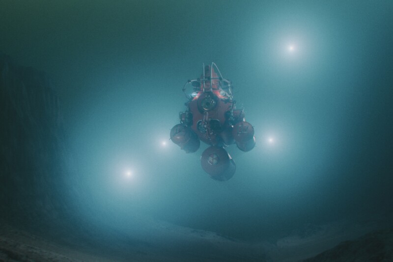 Concept image of deep underwater ocean exploration with submarine