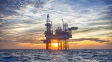 HDR of Offshore Jack Up Rig in The Middle of The Sea at Sunset Time