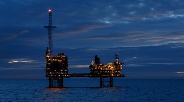 North Sea platform at night with active flare