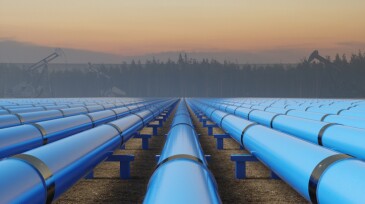 Blue Pipeline Infrastructure at Sunset in Industrial Oil Field