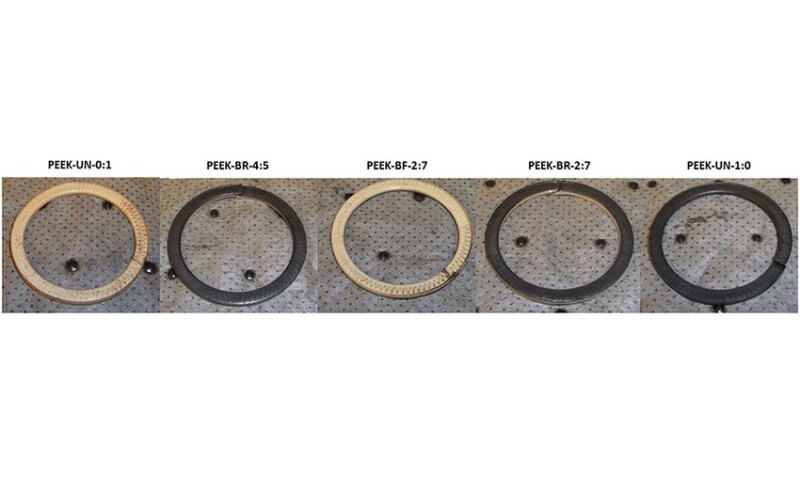 Fig. 1—Specimens after creep tests, including the two single-filament FBURs and the three best-performing architectures.