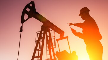 Oil Drill, field pump jack silhouette with setting sun and worker.