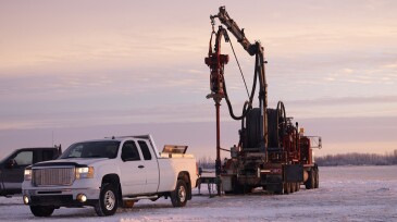 Oil Field Workers at Sunrise