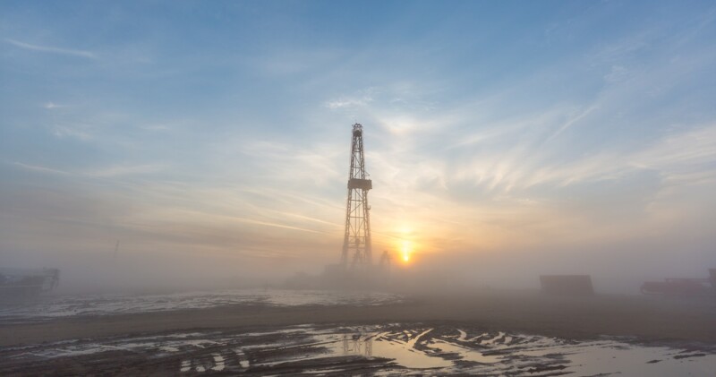 Fracking oil rig in the morning fog