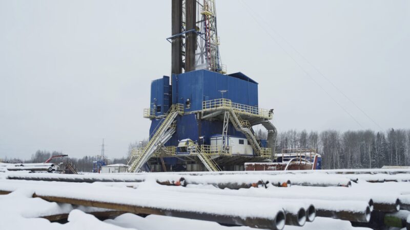 Pipe and drilling rig in the snow
