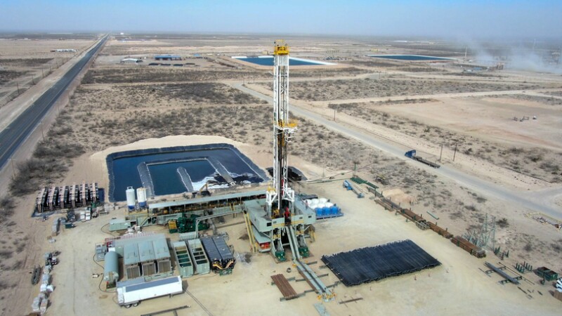 Drone View Of Oil Or Gas Drill Fracking Rig Pad As The Sun Rises In New Mexico