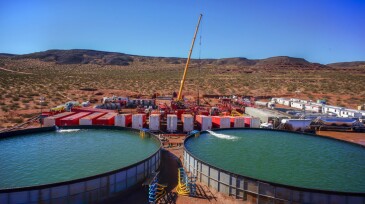 Vaca Muerta, Argentina, August 26, 2014: Extraction of unconventional oil. Battery of pumping trucks for hydraulic fracturing (Fracking).