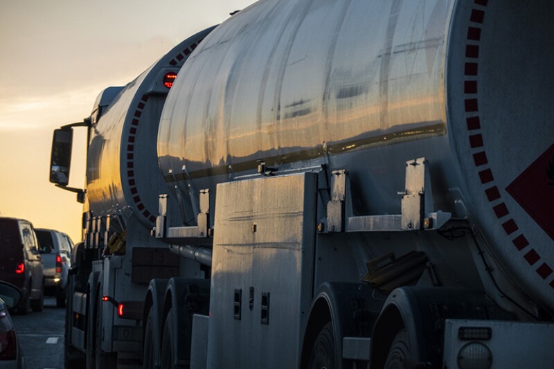 Tanker truck on highway at dusk