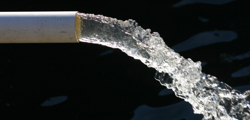 Close-up of water pipe with pouring water