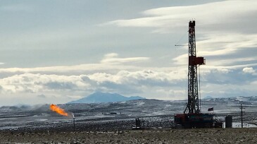 Oil rig in the Powder River Basin. Laramie Peak in the background.