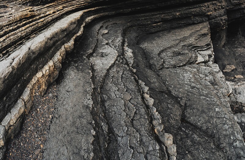 Layers of shale line coastline.