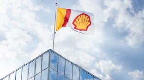 Shell flag over building.