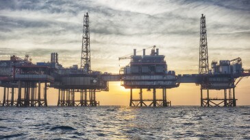 Offshore oil platform at sunset
