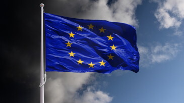 EU flag above dark sky