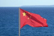 Chinese national flag at the coast near the sea