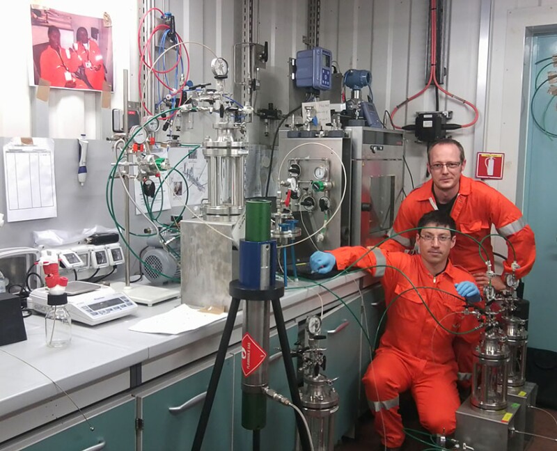 Stephane Jouenne with colleague Guillaume Heurteux in the quality control lab of Dalia FPSO during the polymer-sampling campaign in 2012.