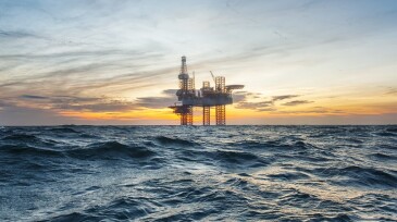Offshore drilling rig at sunset