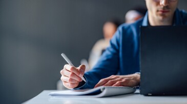 Close Up Photo Of Man Hands Writing Notes In A Notebook During Lecture At College
