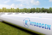 Metal pipeline with green field and blue sky background