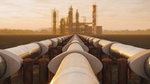 Oil Refinery And Pipeline In Desert During Sunset