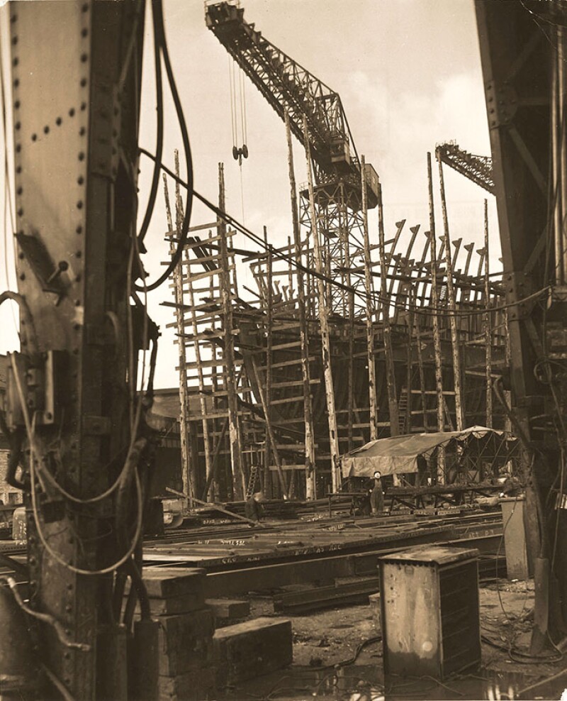 An oil tanker takes shape on the River Clyde in Scotland as Europe’s postwar oil activities expand.