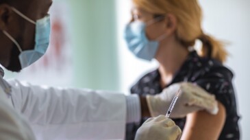 Young woman getting vaccinated