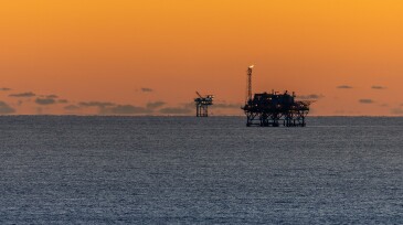 Offshore Drilling Platforms during Sunset in the Gulf of Mexico