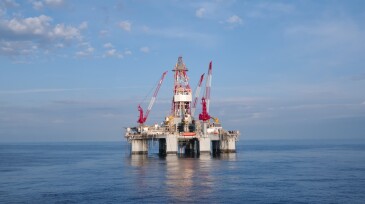 Ocean oil drilling platform and sky
