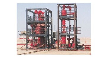 Fig. 1—SMS wellhead desander (right) and wellhead filter (left).