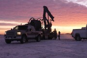 Oil Field Workers at Sunrise