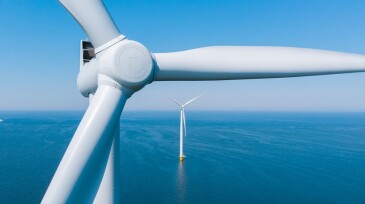 Green energy Windmill turbine in ocean, aerial view of windmill park in the Netherlands