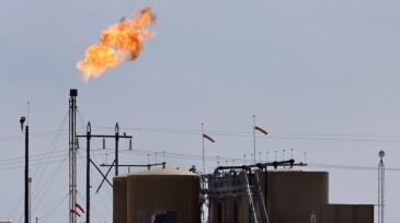 Flaming petroleum pollution gas flare storage tanks Big Spring fracking Texas